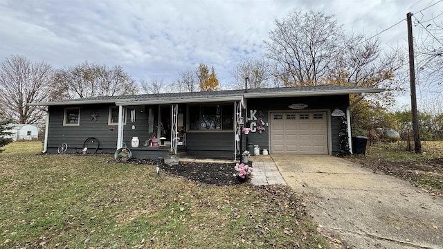 single story home with a garage, concrete driveway, and a front yard