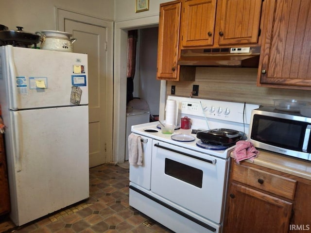 kitchen with light countertops, white appliances, brown cabinets, and under cabinet range hood