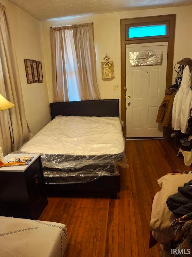 bedroom featuring wood-type flooring