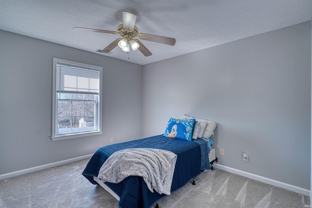 bedroom featuring baseboards, visible vents, and carpet flooring