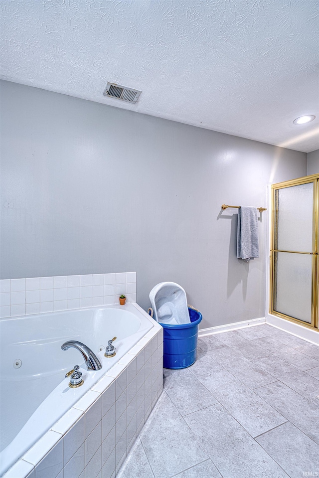 bathroom featuring visible vents, a stall shower, a textured ceiling, tile patterned flooring, and a whirlpool tub