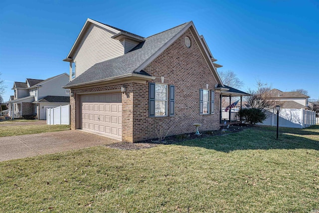 view of home's exterior featuring an attached garage, brick siding, fence, a yard, and driveway