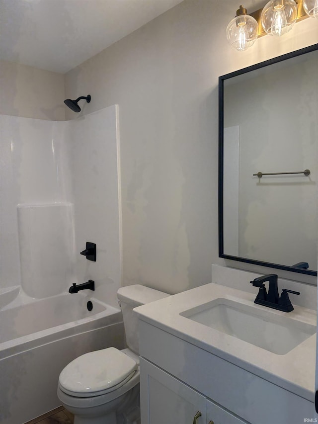 bathroom with toilet, washtub / shower combination, and vanity