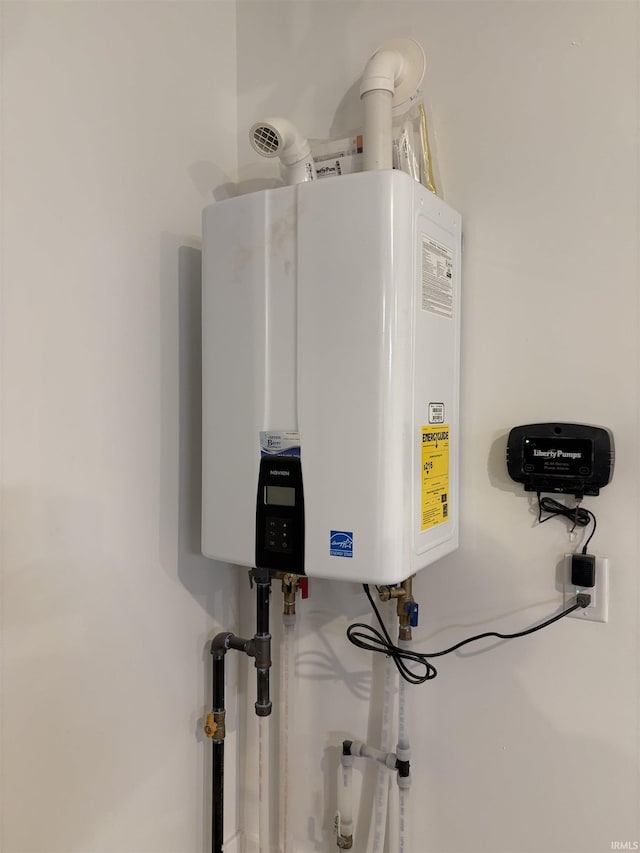 utility room with tankless water heater