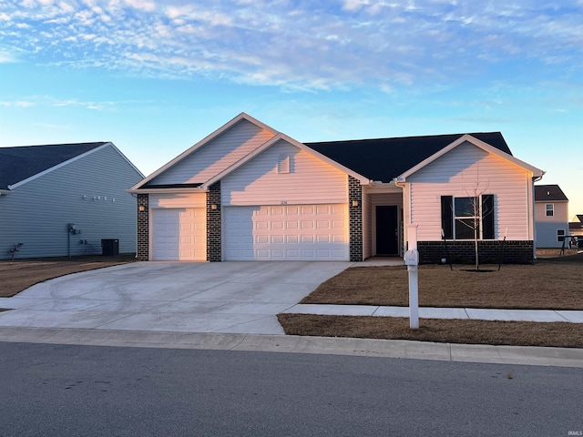 ranch-style home with concrete driveway, brick siding, central AC, and an attached garage