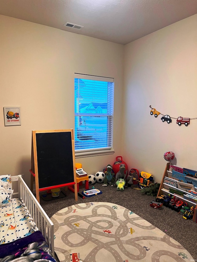 bedroom with carpet floors and visible vents