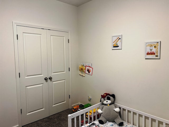 bedroom with a nursery area and a closet