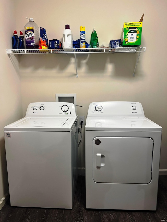 washroom featuring dark wood-style floors, laundry area, and separate washer and dryer