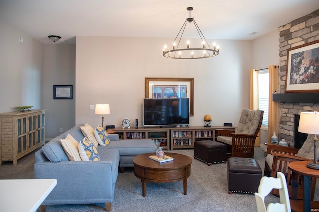 carpeted living area with a notable chandelier and a fireplace