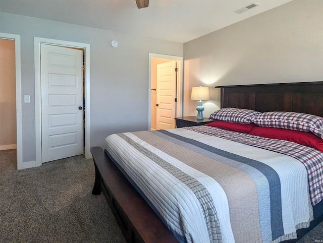 bedroom with carpet, visible vents, and baseboards