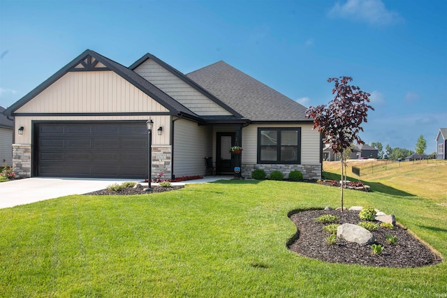 craftsman inspired home featuring a garage, driveway, stone siding, roof with shingles, and a front yard