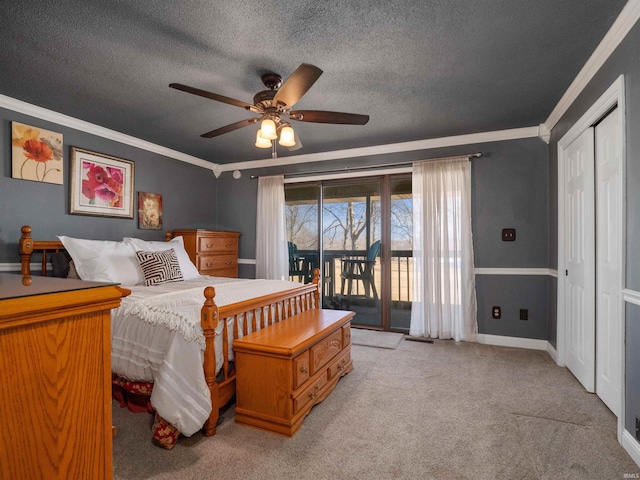 bedroom with light colored carpet, ornamental molding, a textured ceiling, access to outside, and baseboards