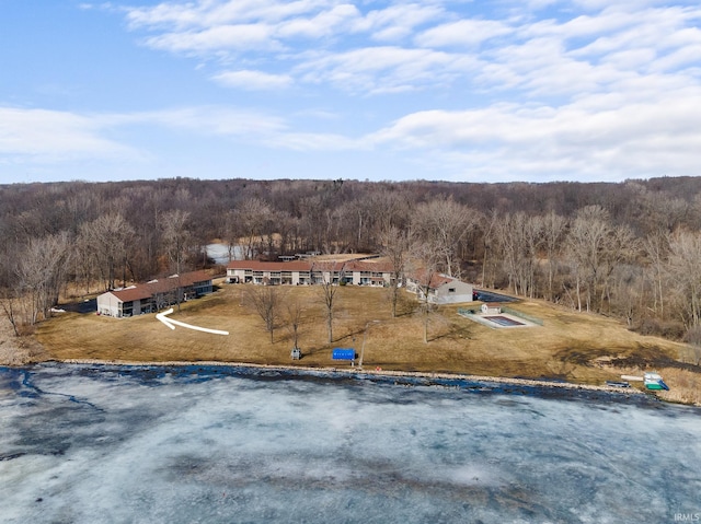 birds eye view of property with a forest view