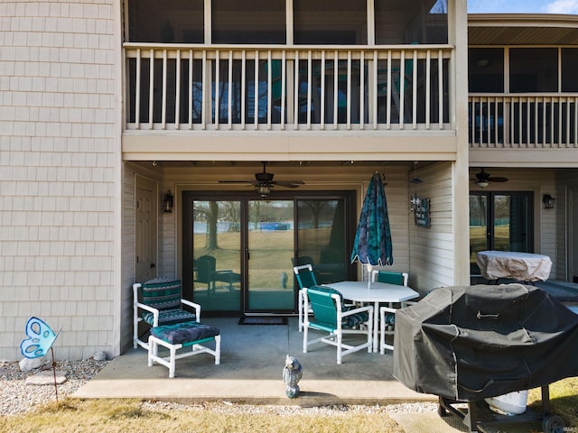 view of patio / terrace featuring a balcony, ceiling fan, and area for grilling