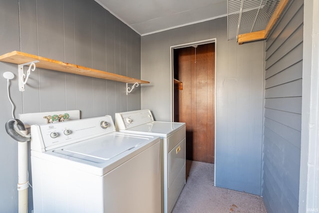 washroom featuring laundry area and washing machine and dryer