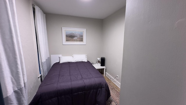 bedroom featuring baseboards