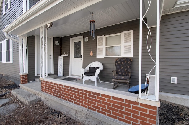 view of exterior entry with covered porch