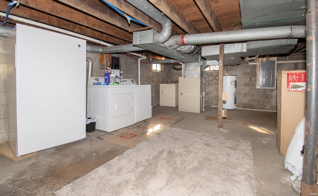 basement featuring washing machine and dryer, electric panel, and water heater