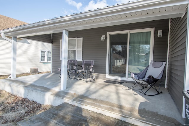 view of patio with a porch and central AC