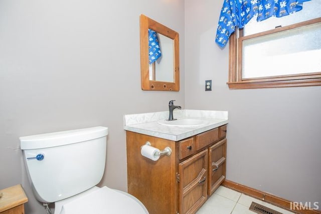 bathroom with tile patterned flooring, visible vents, vanity, and toilet