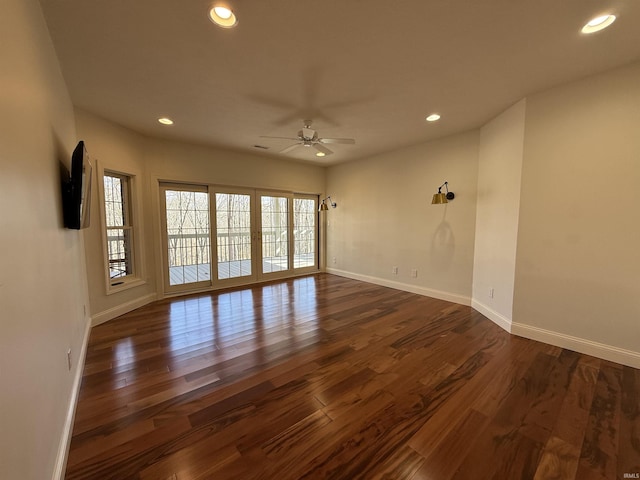 unfurnished room with dark wood-style flooring, french doors, recessed lighting, ceiling fan, and baseboards