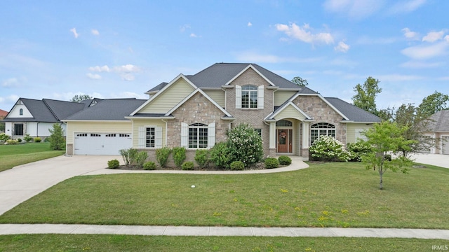 craftsman inspired home with an attached garage, brick siding, driveway, stone siding, and a front yard