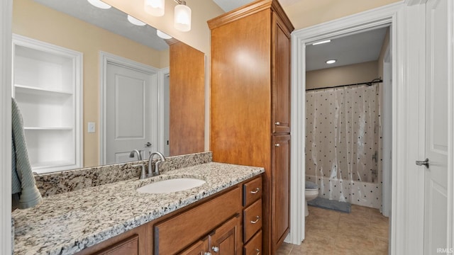 bathroom with tile patterned flooring, a shower with shower curtain, vanity, and toilet