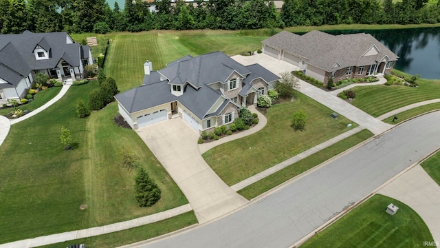 bird's eye view featuring a residential view and a water view