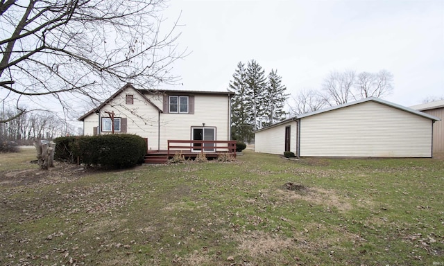 back of house with a wooden deck and a yard