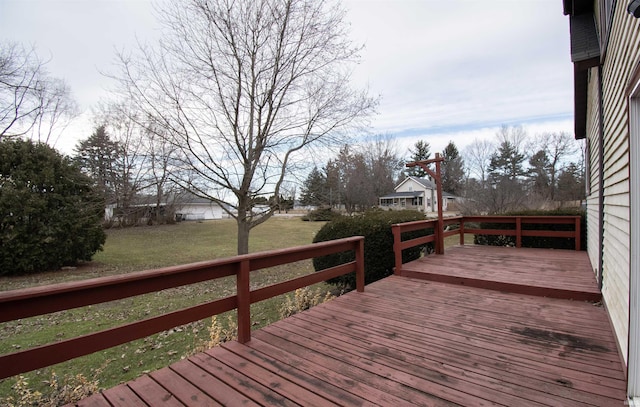 deck featuring a yard