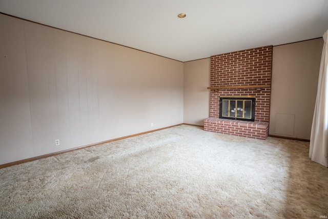 unfurnished living room featuring carpet and a fireplace