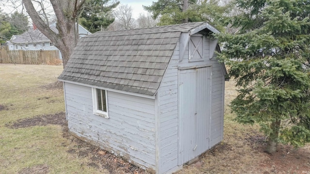 view of shed with fence