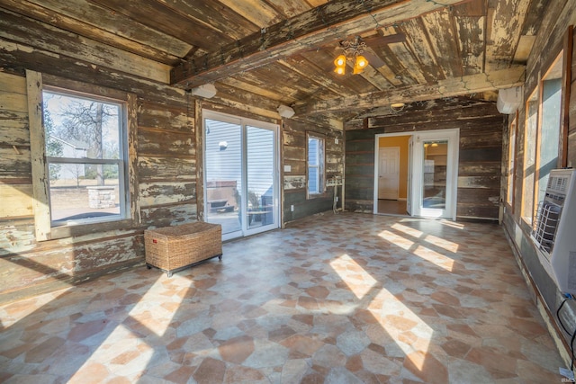 unfurnished sunroom with wood ceiling and a wealth of natural light