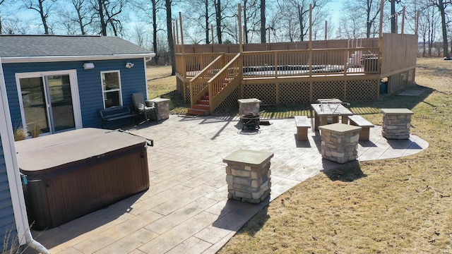 view of patio / terrace with a hot tub and a wooden deck