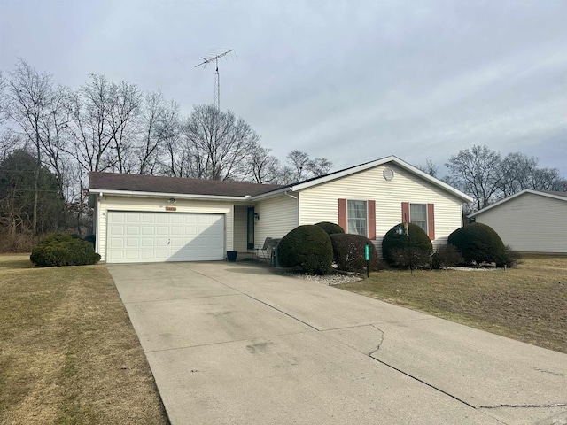 ranch-style home with an attached garage, concrete driveway, and a front yard