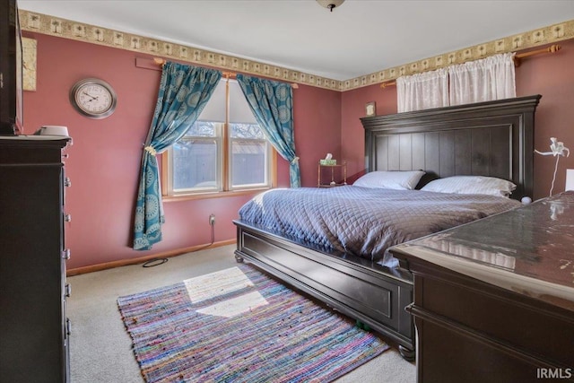 carpeted bedroom with baseboards