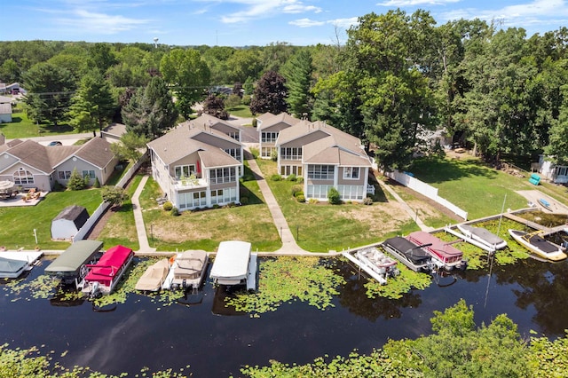 bird's eye view featuring a residential view and a water view