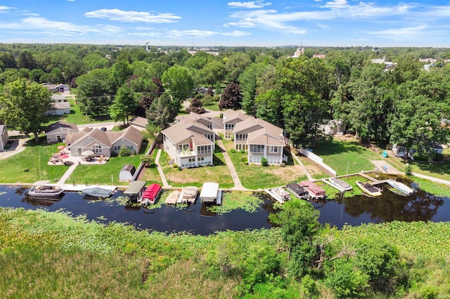 birds eye view of property with a water view and a residential view