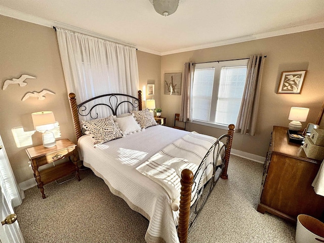 bedroom with baseboards, crown molding, and light colored carpet