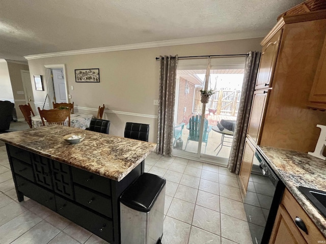 kitchen featuring a textured ceiling, light stone counters, black dishwasher, a center island, and crown molding