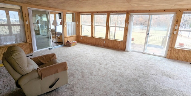 sunroom featuring wooden ceiling