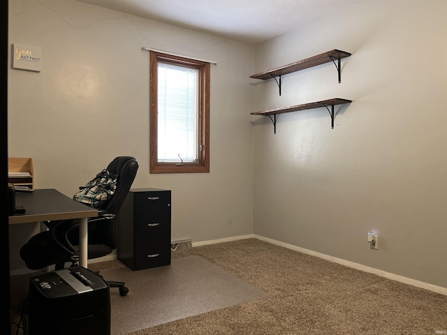 carpeted office space featuring baseboards