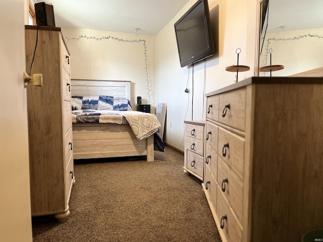 bedroom featuring dark colored carpet