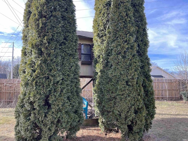 view of home's exterior with fence