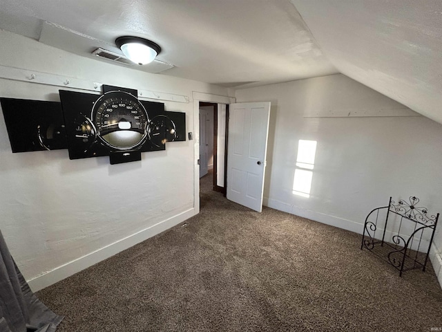 additional living space with lofted ceiling, carpet, and baseboards