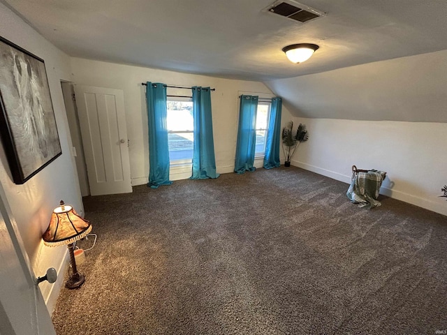 bonus room featuring carpet floors, baseboards, visible vents, and vaulted ceiling