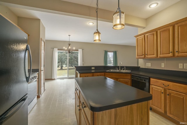 kitchen with brown cabinetry, dark countertops, a sink, and black appliances