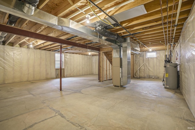 below grade area featuring heating unit and gas water heater