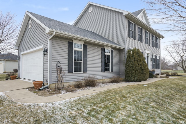 view of side of home featuring a garage, a yard, and a shingled roof