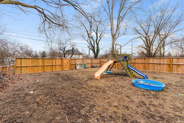 view of playground featuring a fenced backyard